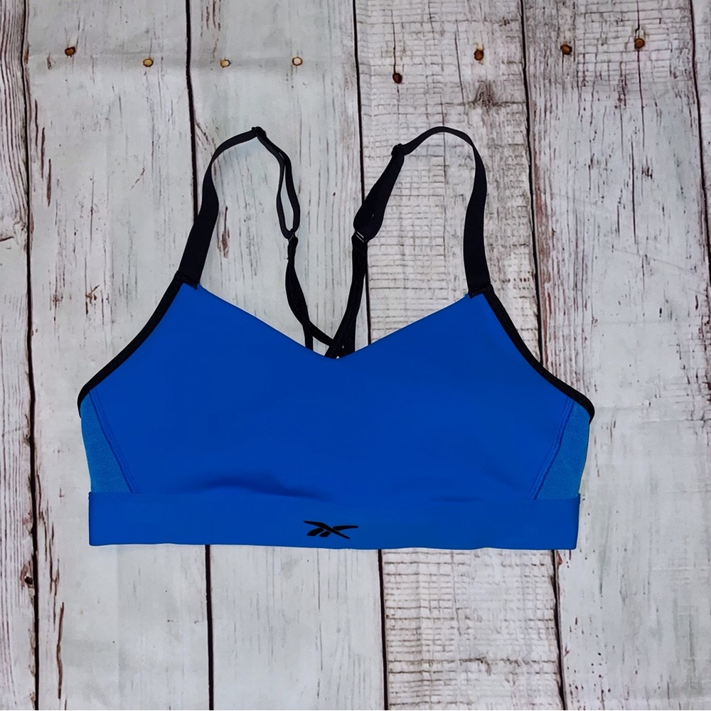 NWOT Reebok Women’s Sports Bra mesh sides bright blue size med adjustable straps